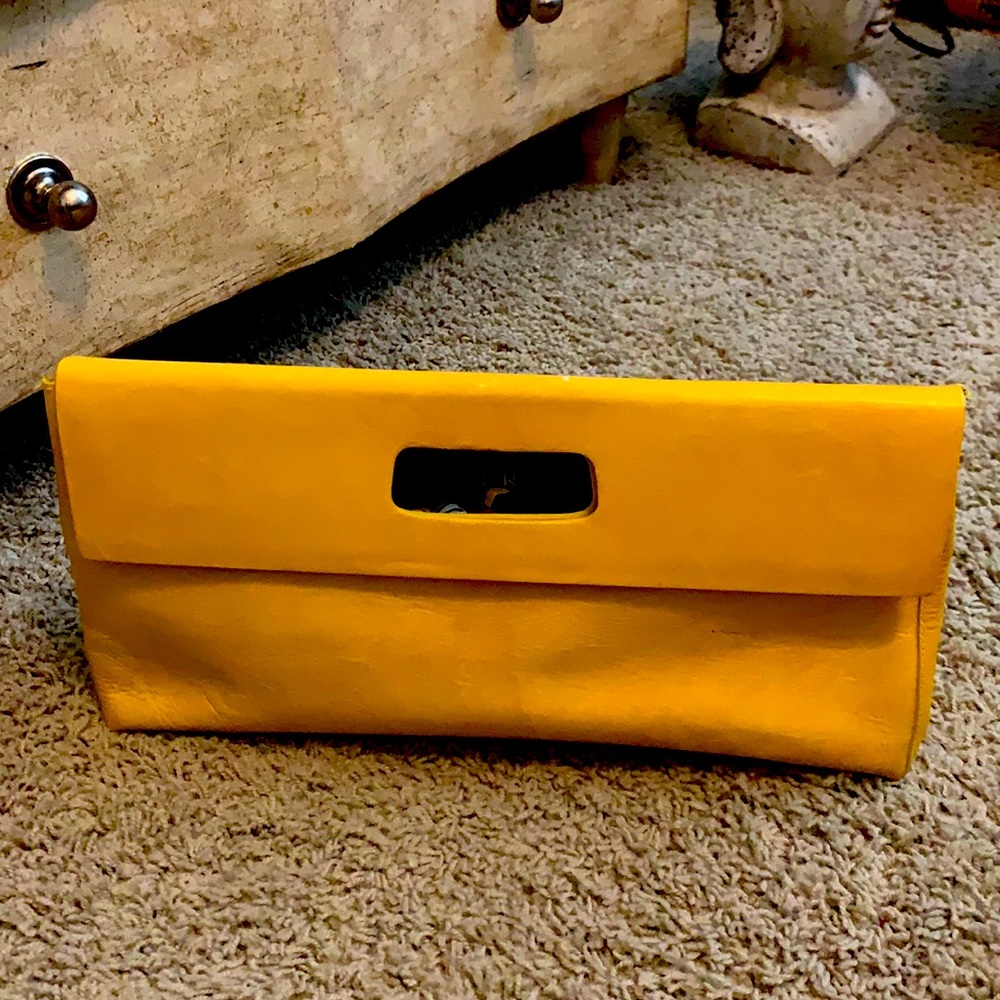Yellow clutch-love this bag but don’t use it as much anymore so, time to sell:-)